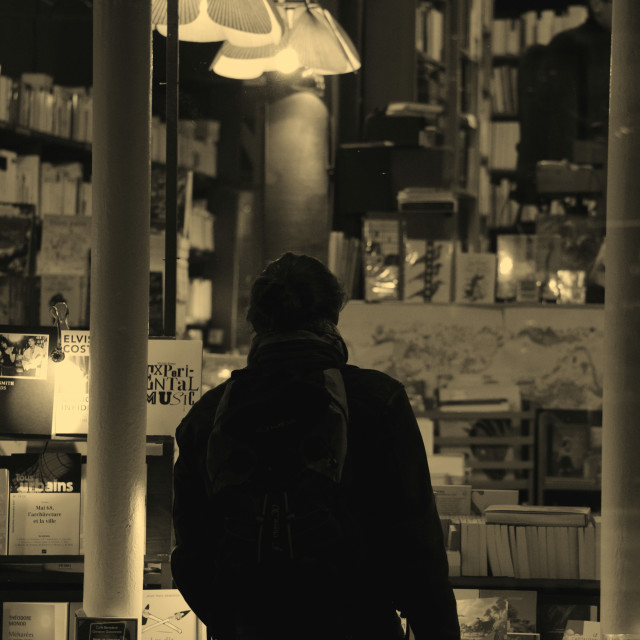 "Looking for something to read" by Amit Mendelsohn - £50.00 "Looking for something to read" stock image