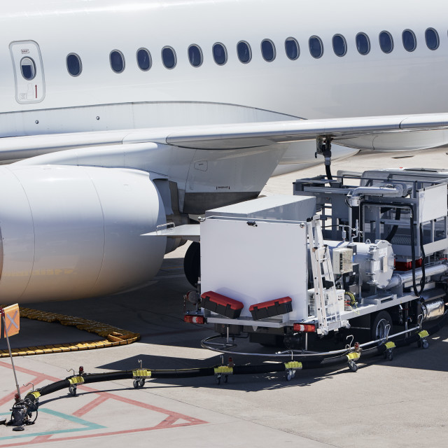 "Refueling of airplane at airport" stock image