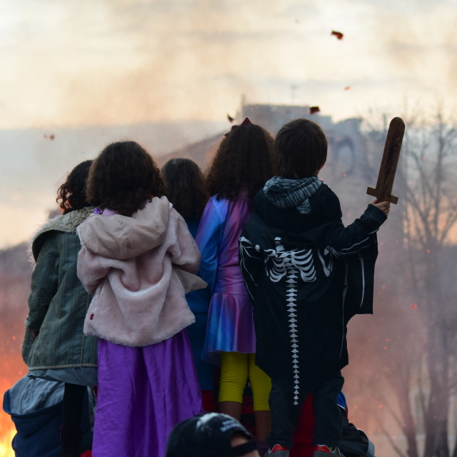 "Children watching fire" by Amit Mendelsohn - £50.00 "Children watching fire" stock image