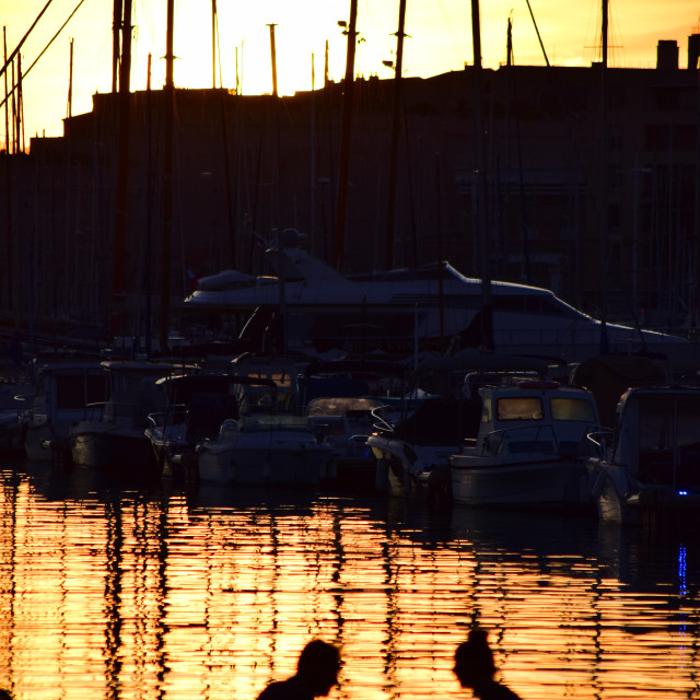 "A couple on the port in the sunset" stock image