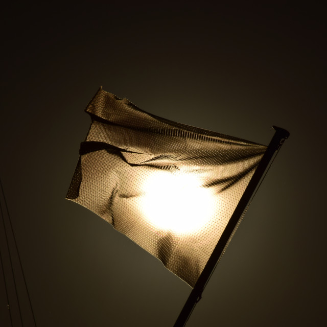 "The sun behind a flag" by Amit Mendelsohn - £50.00 "The sun behind a flag" stock image