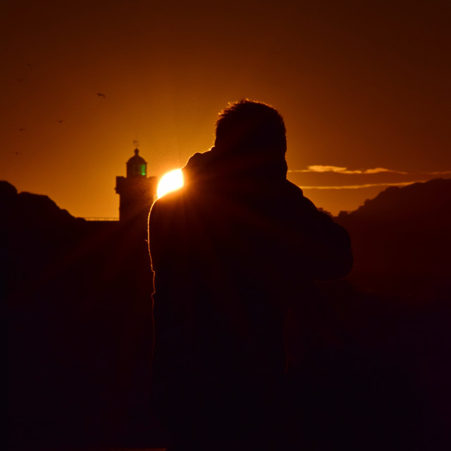 "A photographer in the sunset" stock image