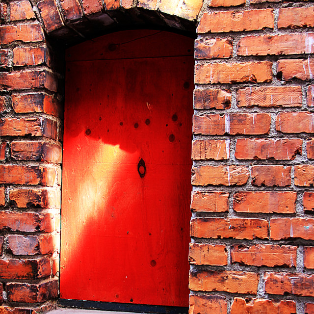 "Red Door and Red Brick Wall in Chinatown" stock image