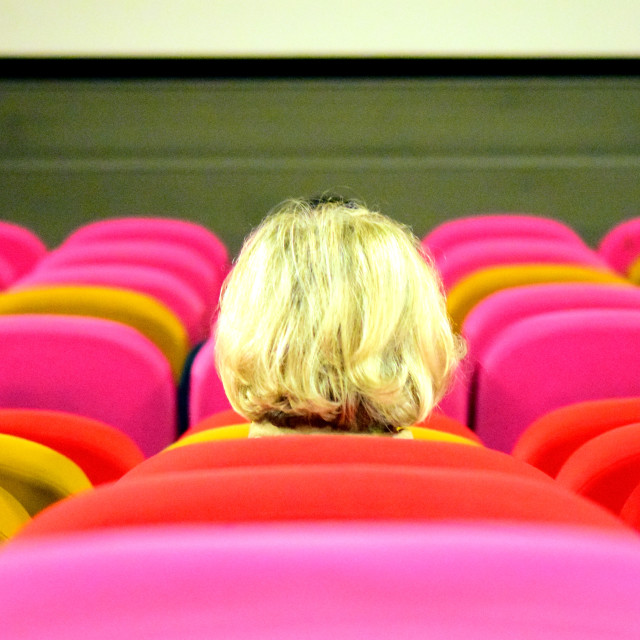 "Alone in the cinema" by Amit Mendelsohn - £50.00 "Alone in the cinema" stock image