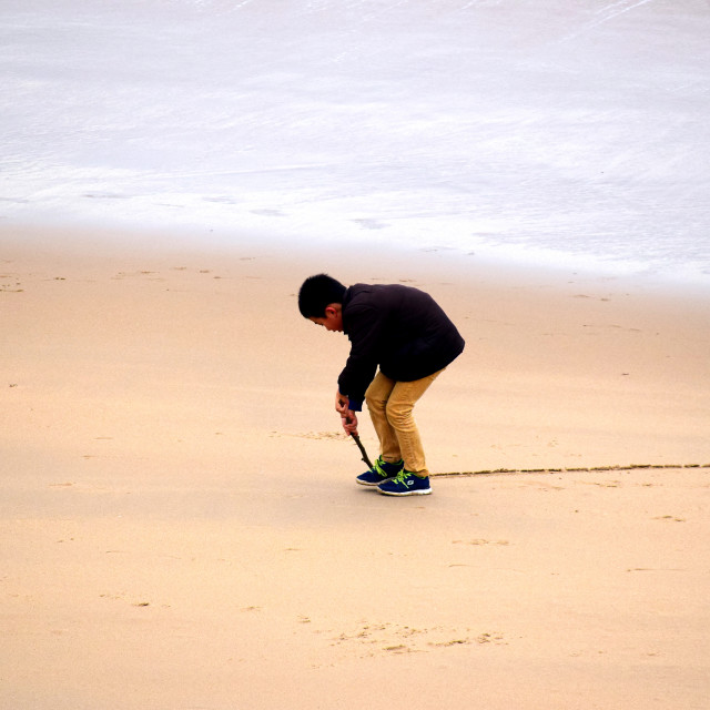 "A boy drawing in the sand" by Amit Mendelsohn - £50.00 "A boy drawing in the sand" stock image