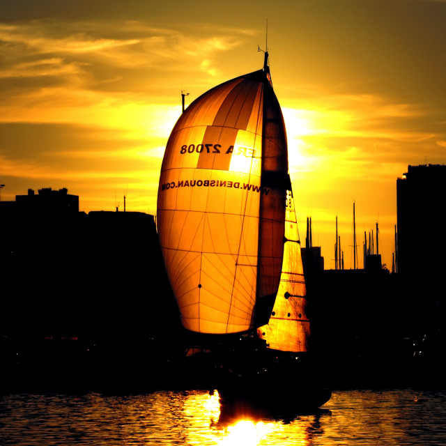 "A sailboat in the sunset" stock image