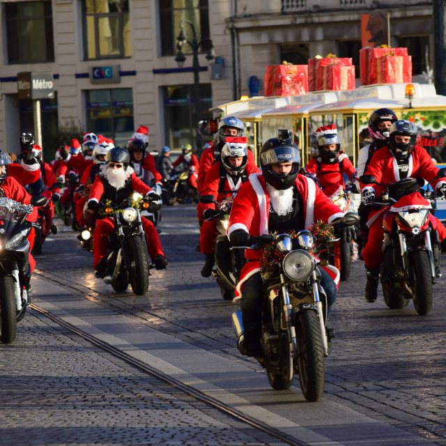 "Santa clauses on motorcycles" by Amit Mendelsohn - £50.00 "Santa clauses on motorcycles" stock image