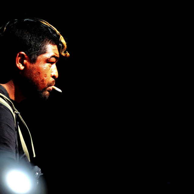 "A man smoking" by Amit Mendelsohn - £50.00 "A man smoking" stock image