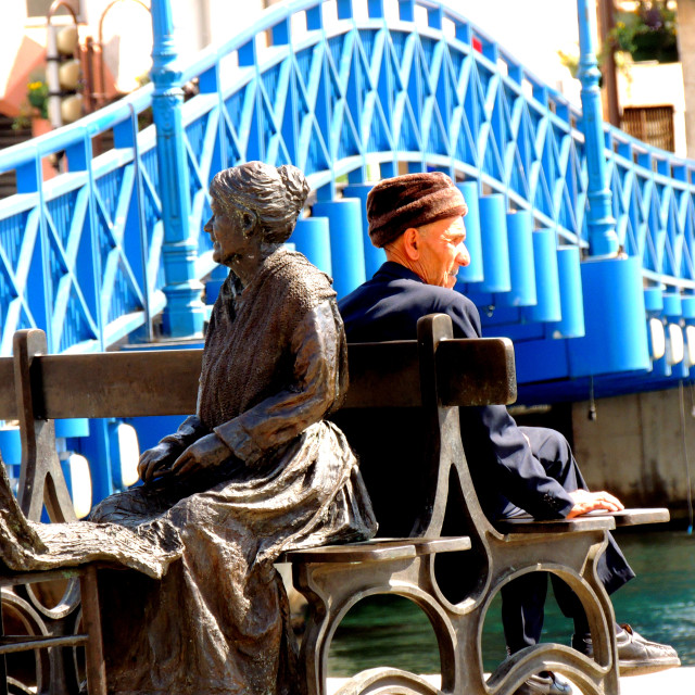 "Martigues a statue on the bench" by Amit Mendelsohn - £50.00 "Martigues a statue on the bench" stock image