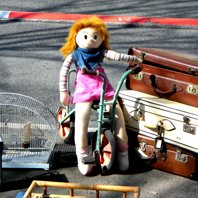 "Doll on a bicycle" by Amit Mendelsohn - £50.00 "Doll on a bicycle" stock image