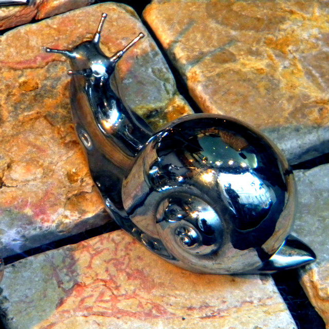 "A metal snail" by Amit Mendelsohn - £50.00 "A metal snail" stock image