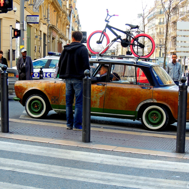 "Very old car very young bikes" by Amit Mendelsohn - £50.00 "Very old car very young bikes" stock image