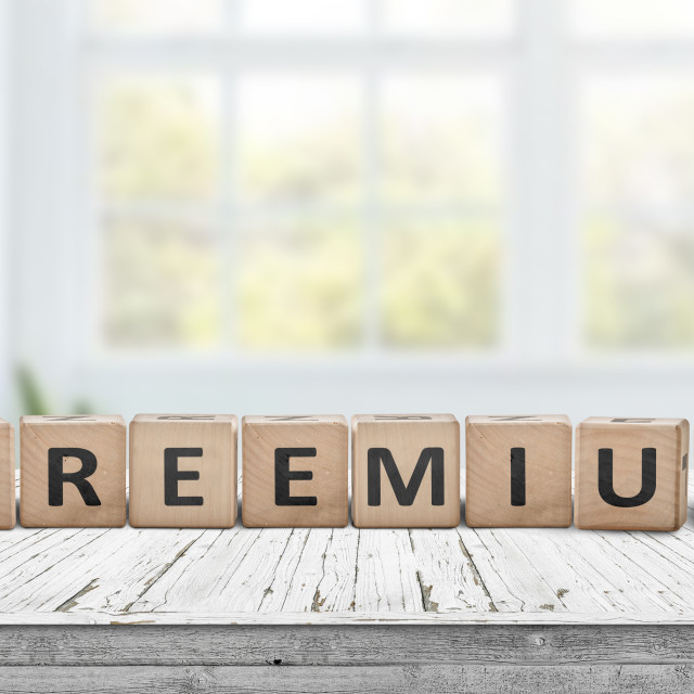 "Freemium trend sign on a desk in a bright office" stock image