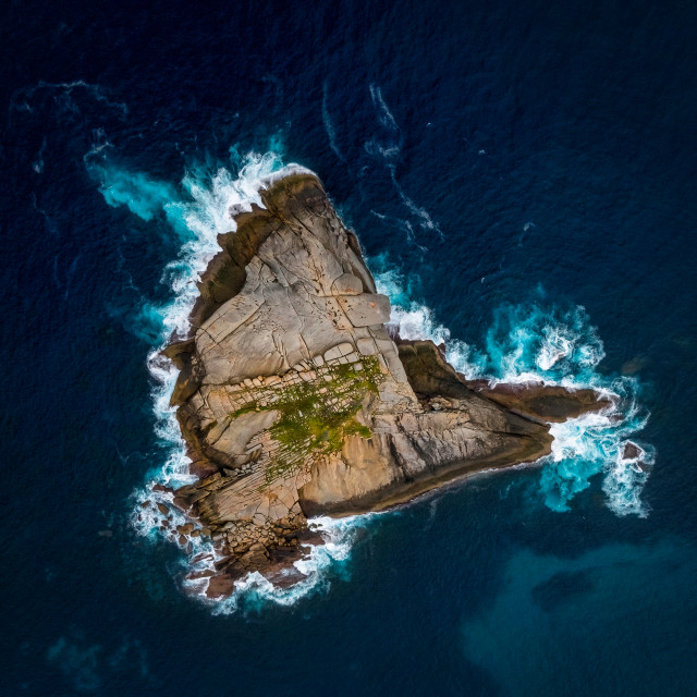 "Rocky Island with Breaking Surf" stock image