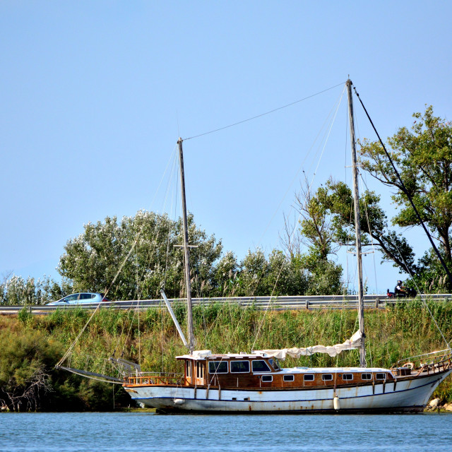 "A boat in the camargues water ways" by Amit Mendelsohn - £50.00 "A boat in the camargues water ways" stock image