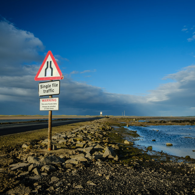 "Tidal causway at Holy Island, Northumberland, England" stock image