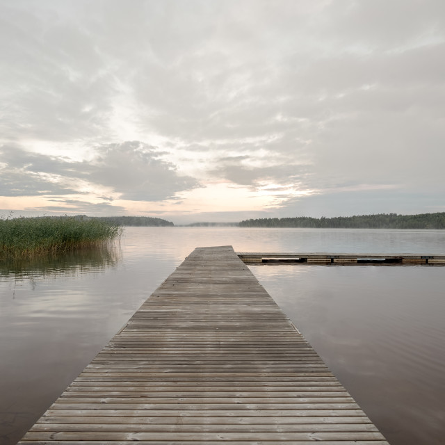 "Jetty over the misty lake" stock image