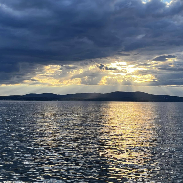 "Dark Clouds over the water" stock image