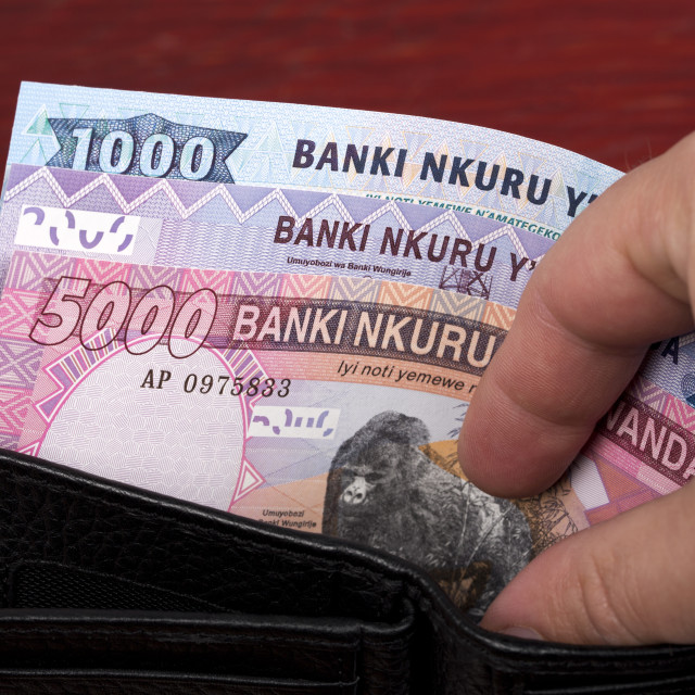 "Rwandan money in the black wallet" stock image