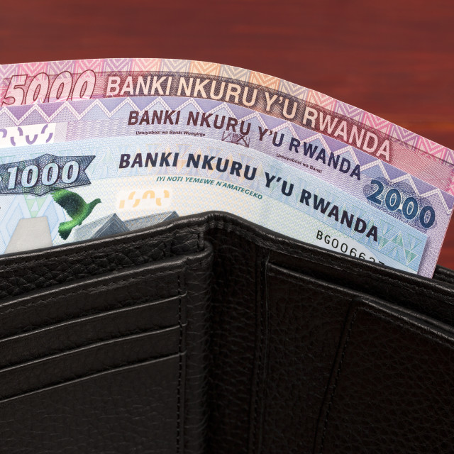 "Rwandan money in the black wallet" stock image
