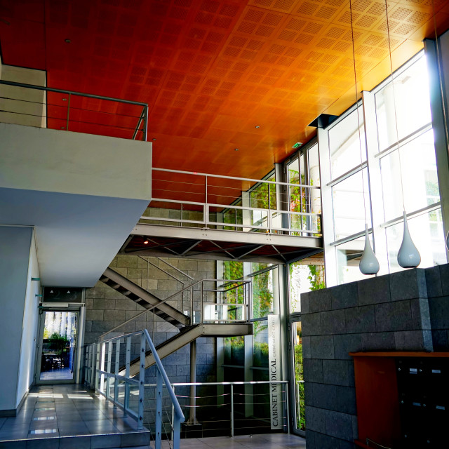 "an entrance of an office building" stock image