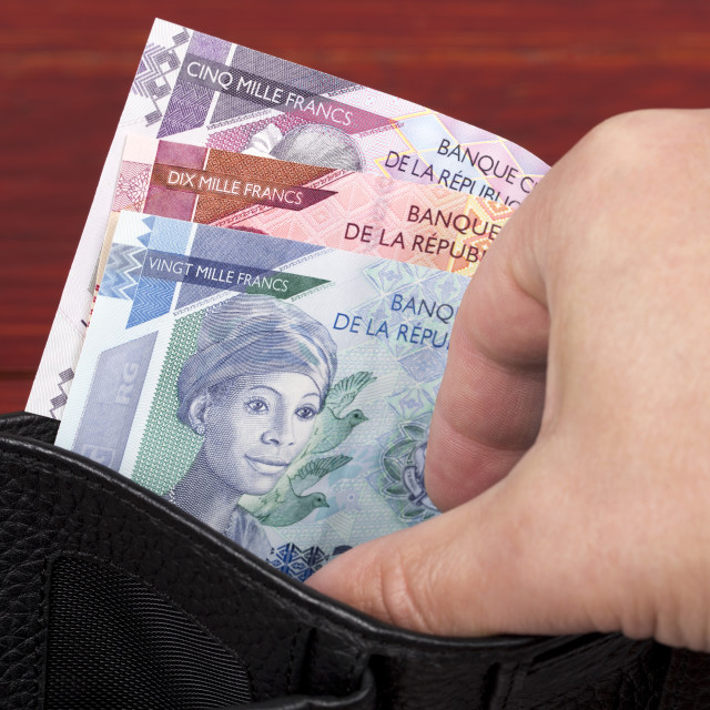 "Guinean franc in the black wallet" stock image