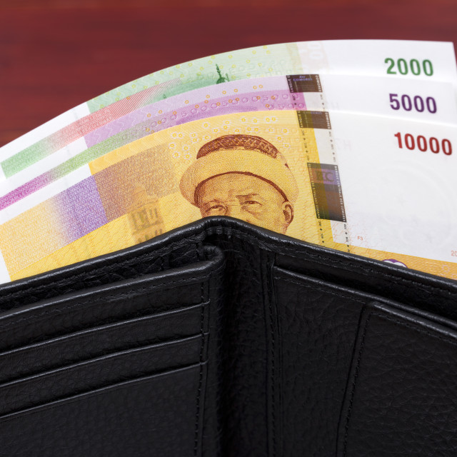 "Comorian money in black wallet" stock image