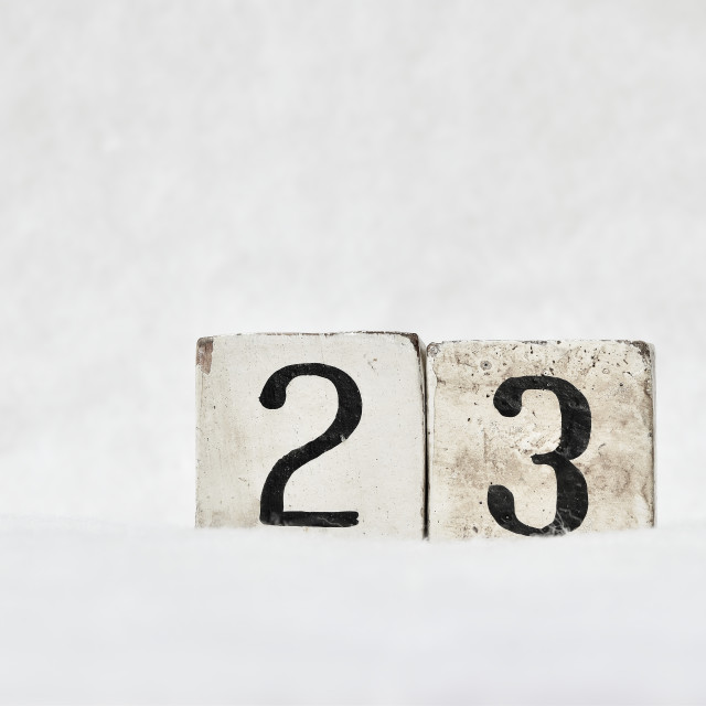 "23 calendar date number, white snowy winter background copy space" stock image