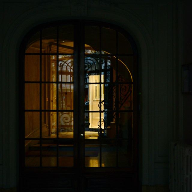 "an entrance at night" stock image