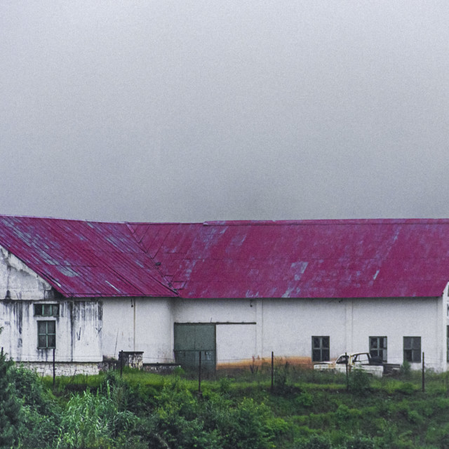 "Red roof warehouse in the mountains" by Expvisual Filmmaking and Photography SAS de CV - $9.88 "Red roof warehouse in the mountains" stock image