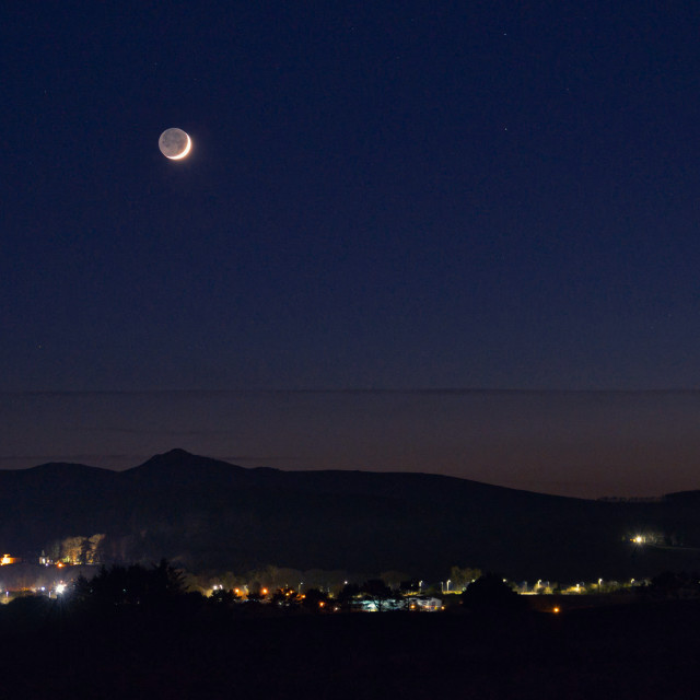 "Crescent moon over Bennachie" stock image