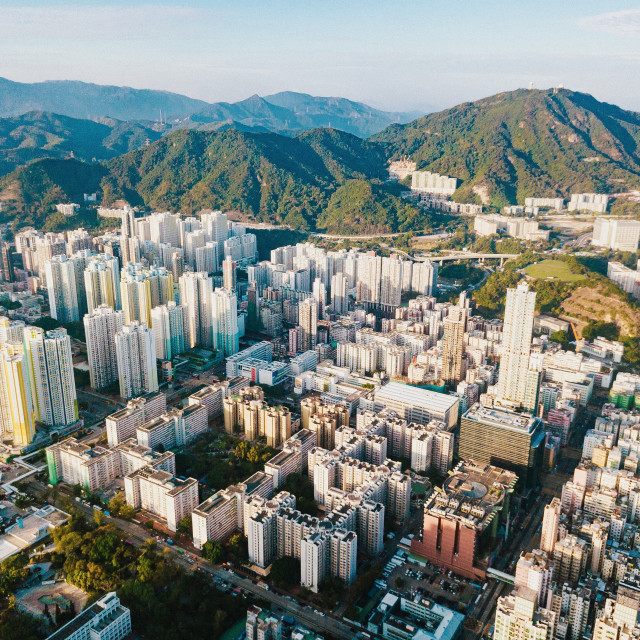 "Aerial city view with crossroads and roads, houses, buildings and parking lots. Helicopter drone shot. Wide Panoramic image. - Image" stock image