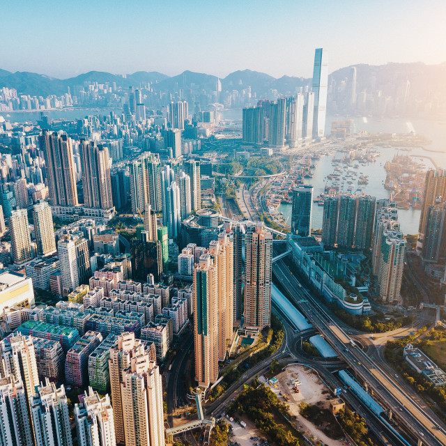 "Aerial city view with crossroads and roads, houses, buildings and parking lots. Helicopter drone shot. Wide Panoramic image. - Image" stock image