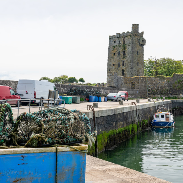 "Carrigaholt Castle with the fishing pier in the foreground, County Clare, Ireland" stock image