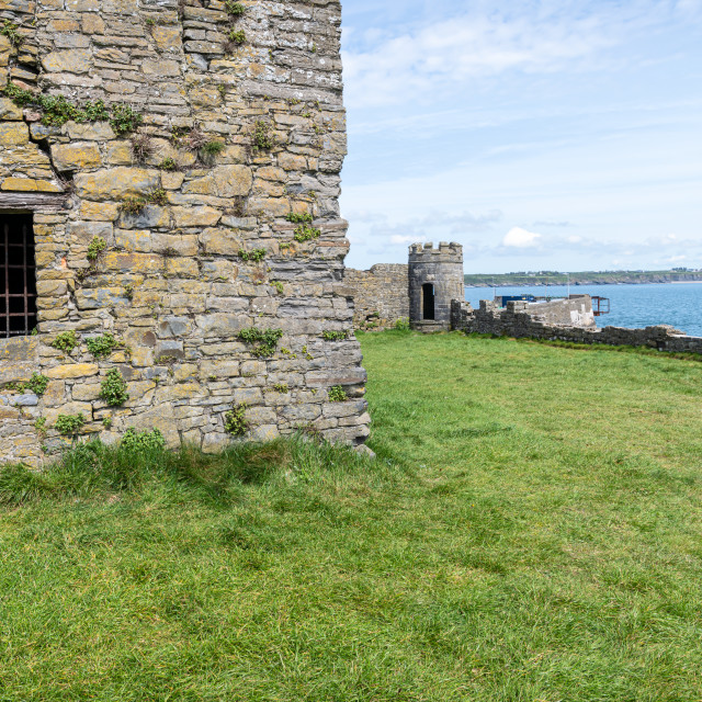 "Fortified window in Carrigaholt Castle with the defensive seawall behind, County Clare, Ireland;" stock image