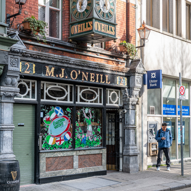 "O’Neill’s traditional Old Irish Pub and clock, Dublin, Ireland" stock image