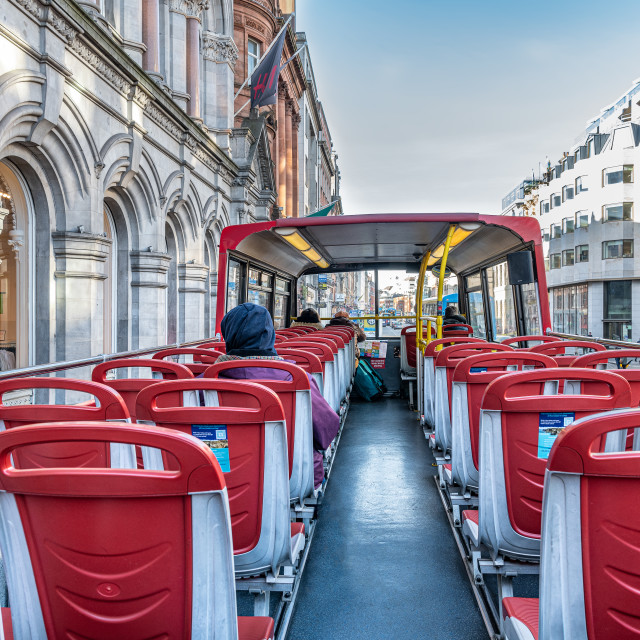 "Passengers on the top deck of an open top tourist bus, Dublin, Ireland" stock image