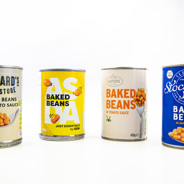 "Low Priced Baked Beans brands from Tesco, Morrisons, Sainsburys and Asda on a white background" stock image