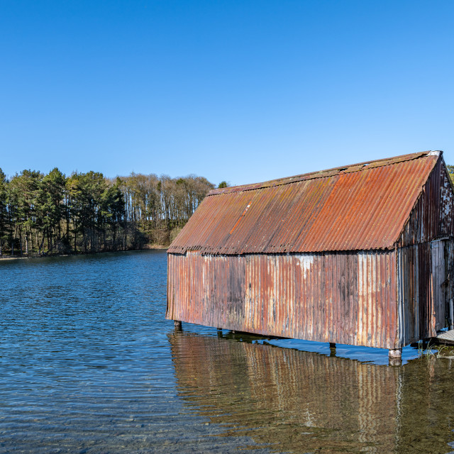 "Rusty old Boathouse on Lindean Reservoir and nature reserve in the Scottish Borders" stock image