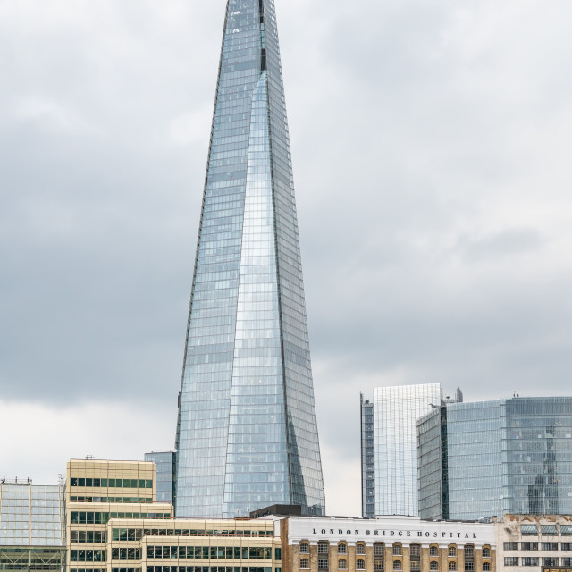 "The Shard Tower with London Bridge Hospital on the South bank of the River Thames, London, England" stock image