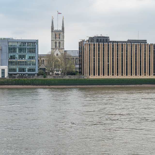 "Southwark Cathedral on the South Bank of the River Thames seen from the North Bank, London, England" stock image