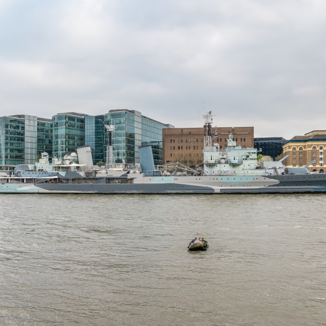 "HMS Belfast, World War Two Military Cruiser, moored on the River Thames, in East London, England" stock image