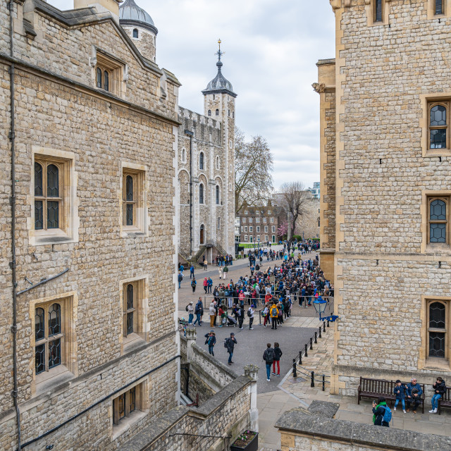 "Tourists in the courtyard between the White Tower and Waterloo Barracks at the Tower of London, London, England" stock image