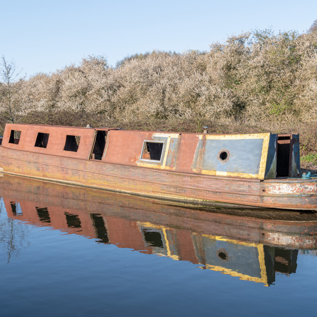 "Rusty Canal Barge Narrow boat Awaiting Restoration on the Grand Union Canal, Rickmansworth, Hertfordshire, England." stock image