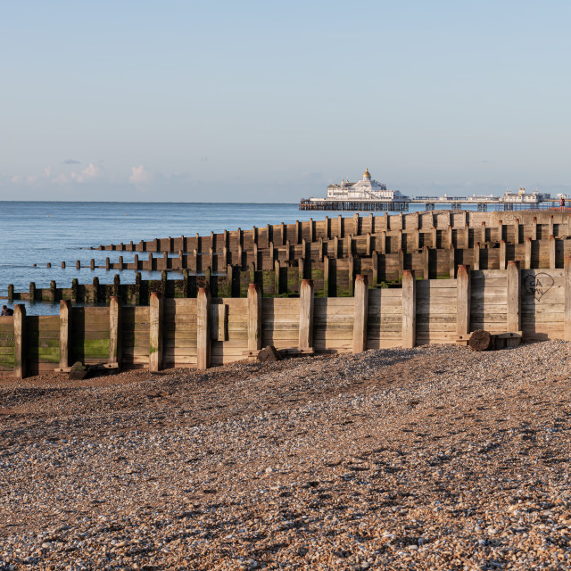 "Eastbourne Pier and Beach with a clear blue sky and calm seas, Eastbourne, England" stock image