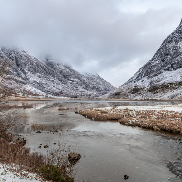 "Loch Achtriochtan and the river Coe and winter snow in Glen Coe, Highlands, Scotland" stock image