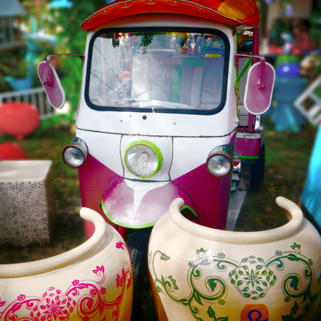 "Giant garden pots and a classic Tuc Tuc" stock image