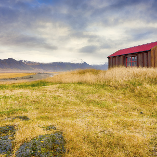 "RED ROOFED CABIN" stock image