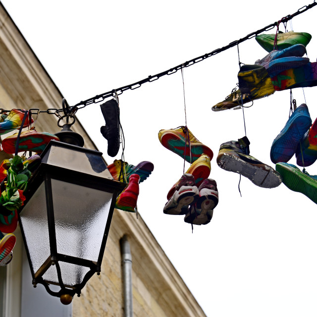 "coloured shoes hanged" stock image