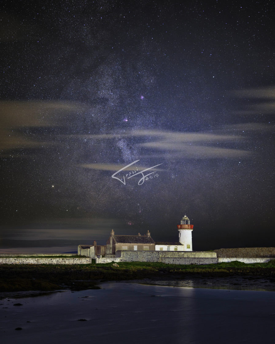 "Milky way over Mutton Island Lighthouse" stock image